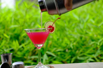 glass of red martini cocktail