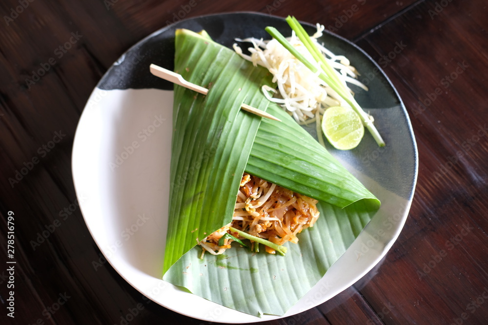 Sticker close up pad thai with shrimp in banana leaf