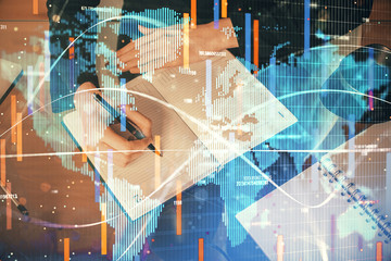 International business hologram over woman's hands taking notes background. Concept of success. Double exposure