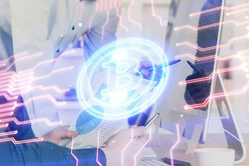 Crypto currency theme hologram with businessman working on computer on background. Concept of blockchain. Multi exposure.