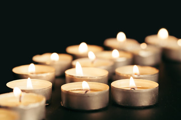 Many burning candles with shallow depth of field
