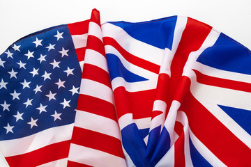 Flags of the USA and brithish Union Jack flag together waving