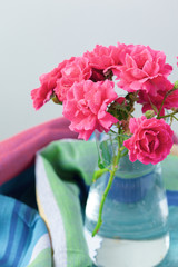 Rose placed on the desk in blue background