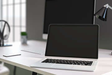 Designer desk with laptop