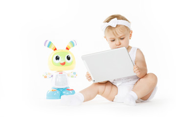 little girl all in white with tablet and toy