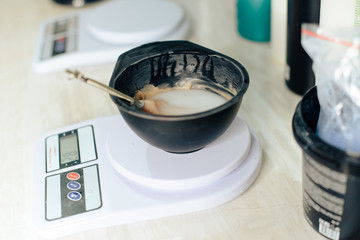 stylist's work with the hair of a girl in a beauty salon