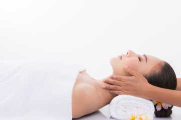 Woman enjoying massage in spa salon.
