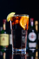 classic cocktail cuba libre with ice and close-up in a cuban bar