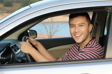 Cute driver looking at camera