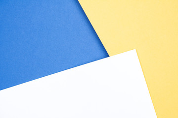 Background (texture) of white, beige and blue paper with shadow