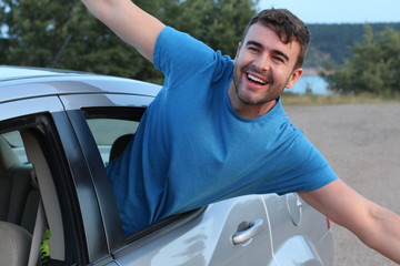 Car passenger feeling free during road trip 