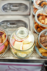 Sweet dessert street food. Marshmallow in a glass jar