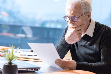 Senior businessman reading a document