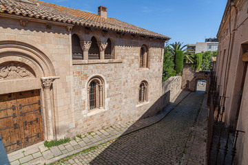 Fototapeta na wymiar Ancient street in old walled enclosure of Monastery of Pedralbes, Barcelona, Catalonia, Spain.