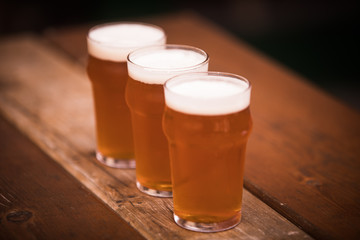 Three pints of beer in a row