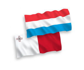 National vector fabric wave flags of Malta and Luxembourg isolated on white background. 1 to 2 proportion.