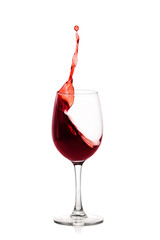 splash of red wine in glass isolated on white background.