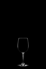 empty wineglass isolated on the black background