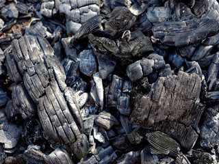 black coals of a burned-out fire. background