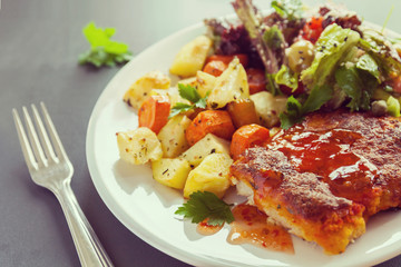 Fish fillet baked with cheese with potatoes, sweet potatoes, carrots and greens and vegetables mix. Fresh Salt dressing seasoned and sprinkled with sesame