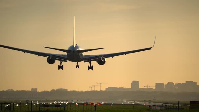 Jet landing at sunrise