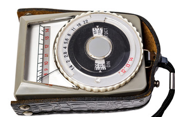 Vintage photo light meter close up isolated over white background