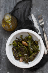 typical spanish food grilled green pepper with salt on dish