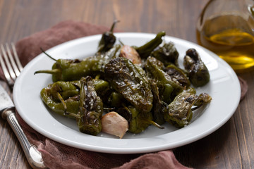 typical spanish food grilled green pepper with salt on dish