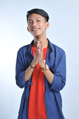 Confidence Asian young man wear casual t-shirts with confident smiling