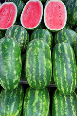 watermelons on display at farmers market