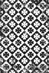 Grunge pattern with signs of clovers. Vertical black and white backdrop.