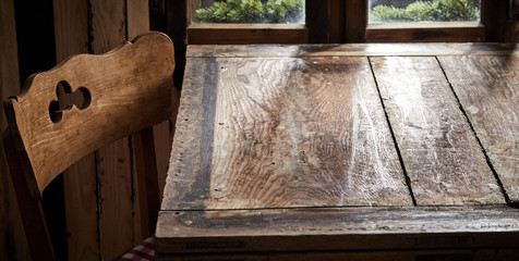 Empty old wooden table and cottage style chair