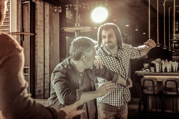 Irritated young man demonstrating his strong fist