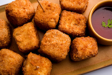 Crispy Paneer popcorn is a popular party snack and an appetiser. selective focus
