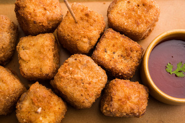 Crispy Paneer popcorn is a popular party snack and an appetiser. selective focus