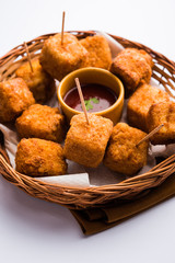 Crispy Paneer popcorn is a popular party snack and an appetiser. selective focus