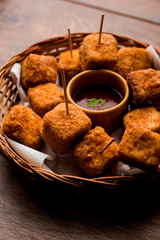 Crispy Paneer popcorn is a popular party snack and an appetiser. selective focus