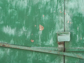 rusty lock hanging on old iron gate