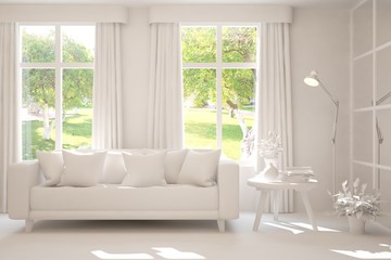 Mock up of stylish room in white color with sofa and green landscape in window. Scandinavian interior design. 3D illustration