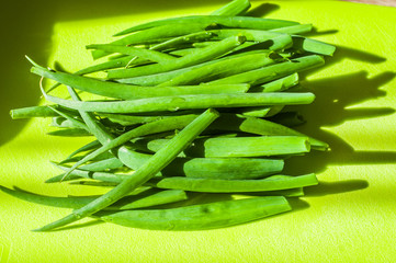 Homemade Green Onions on a Green Kitchen Board