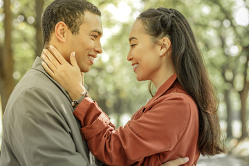Fototapeta premium Short-haired caring man showing his feelings to appealing woman