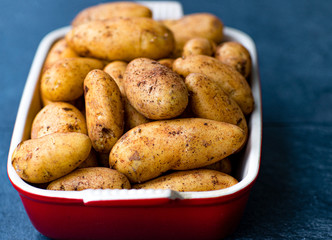 A new crop of potatoes lies in a baking dish.