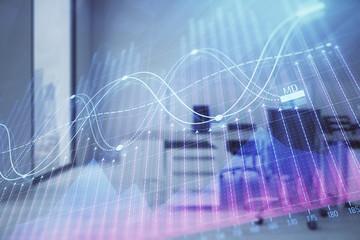 Stock market chart with trading desk bank office interior on background. Double exposure. Concept of financial analysis