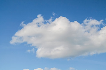 Naklejka na ściany i meble white clouds in the blue sky. background