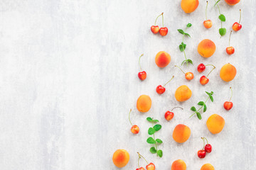 Summer fruits on grey background, flat lay, top view
