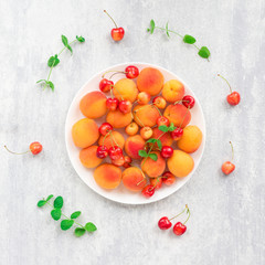 Summer fruits on grey background, flat lay, top view