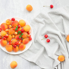 Summer fruits on grey background, flat lay, top view
