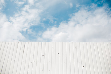 Fototapeta premium white wood texture background, top view wooden plank panel. white wooden fence on a blue sky background