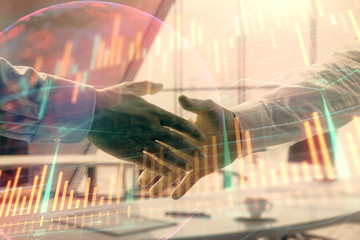 Multi exposure of financial chart and map on office background with two businessmen handshake. Concept of success in business