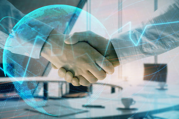 Fototapeta na wymiar Multi exposure of financial chart and map on office background with two businessmen handshake. Concept of success in business